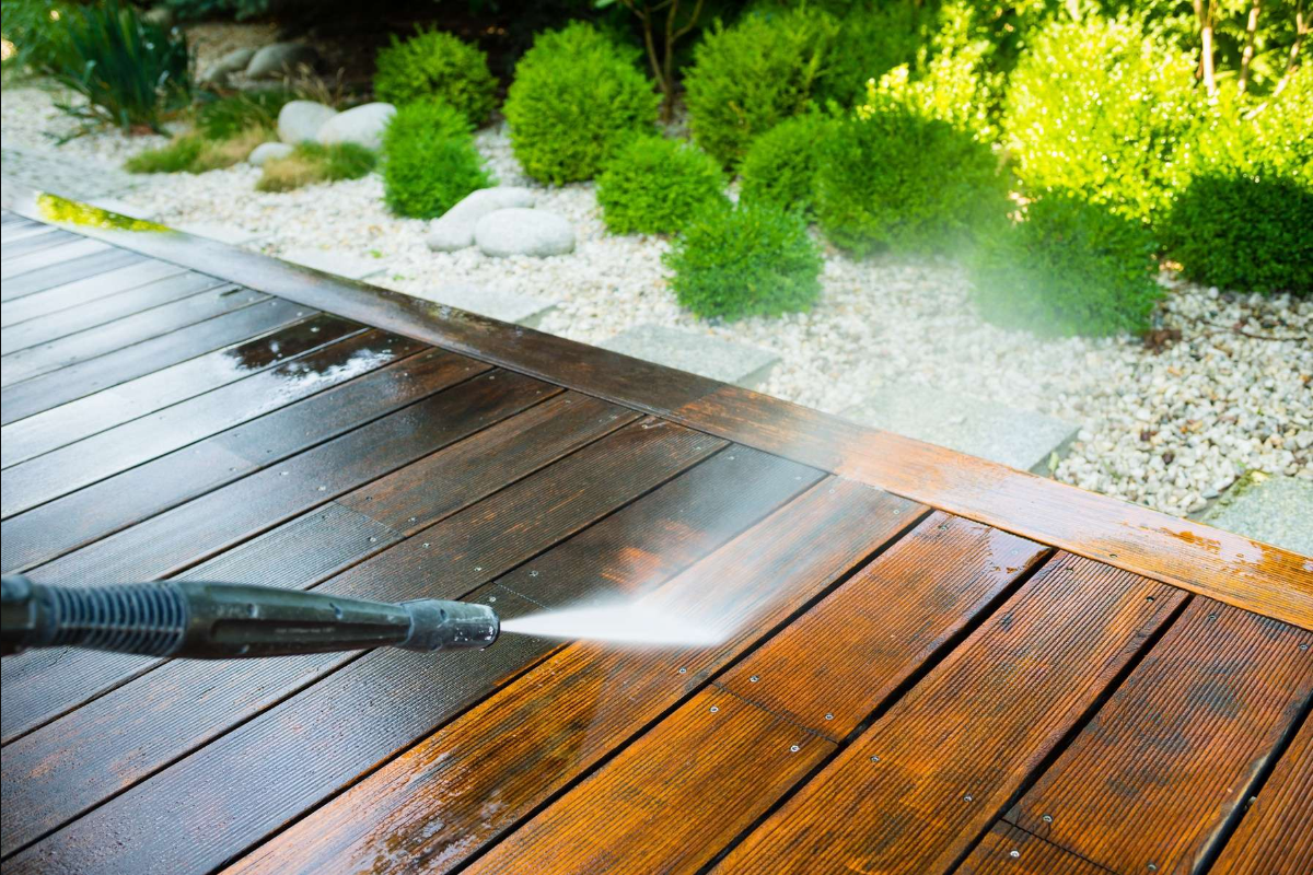 Wooden deck being pressure washed and restored in Marion Ohio